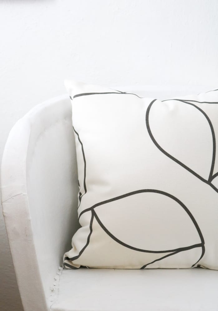 white pillow with black decoration