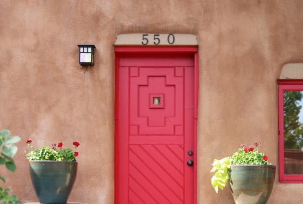 featured image of red door in adobe building